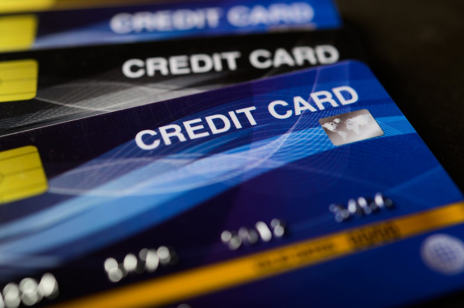 Stacked credit cards demonstrating utilization concepts
